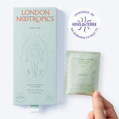 Box of London Nootropics mojo coffee with Cordyceps and Ginseng next to a handheld single-serve sachet on a white backdrop. A sticker in the top right corner reads: Powered by Hifas da Terra Mushroom Extracts.
