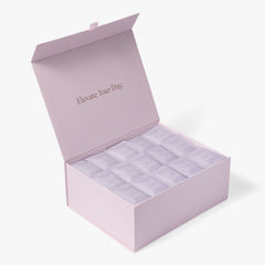 Open pink London Nootropics coffee box full of purple Zen adaptogen coffee sachets